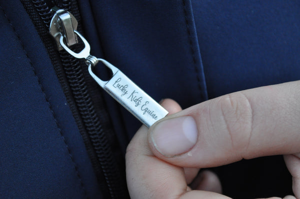 Navy Blue Winter Jacket close up of zip pull