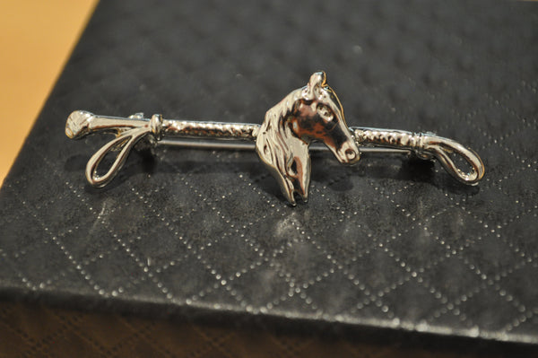 Close up of silver zinc alloy Horse head and Whip Brooch with gift box
