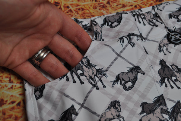 Close up of Jotties with checkered and wild horses pattern pocket