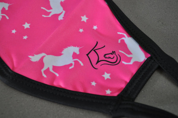Close up of Hot pink with white unicorns and stars small/kids face mask