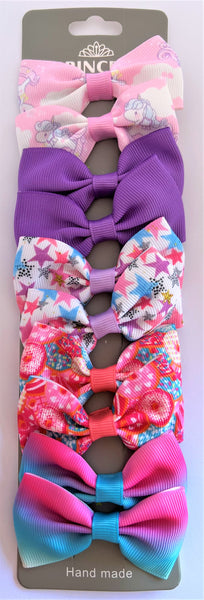 10 pack of pink, purple, blue and white bow hair clips with stars and unicorns